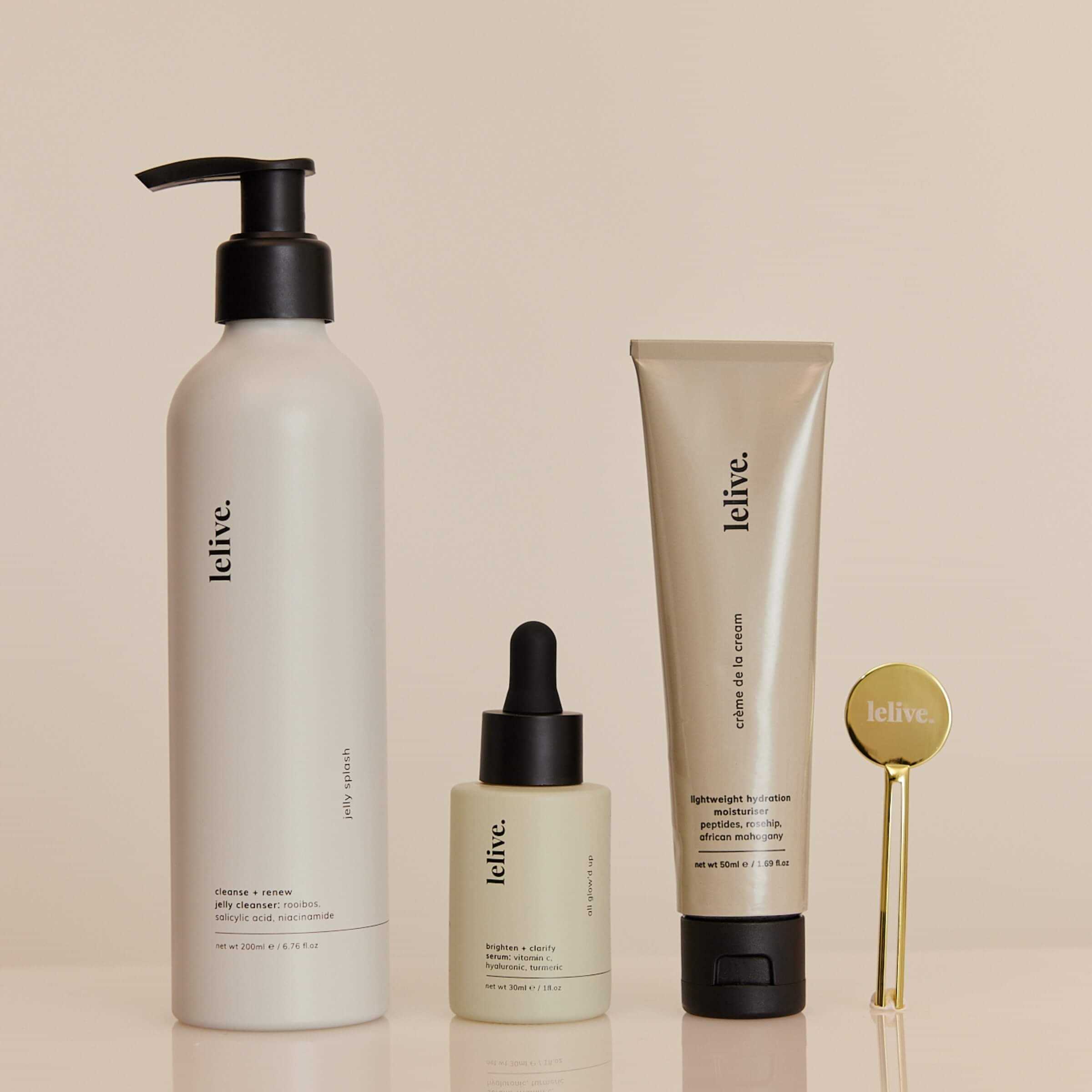 A collection of three skincare products from lelive. a jelly cleanser, brightening serum and peptide moisturiser including a tube key roller.